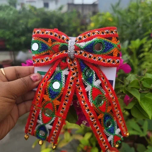 Handmade colorful Garba Dandiya bow with mirror work, decorative detailing and golden bells