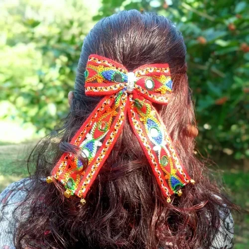 Handmade colorful Garba Dandiya bow with mirror work, decorative detailing and golden bells